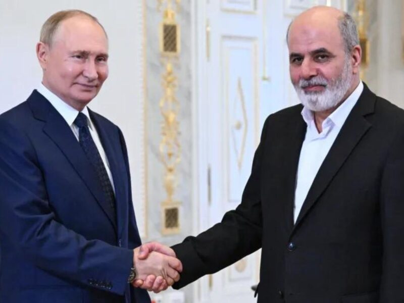 Russian President Vladimir Putin, left, and Iranian Supreme National Security Council Secretary Ali Akbar Ahmadian, right, shake hands during their meeting on the sidelines of a BRICS meeting in St Petersburg, Russia, Thursday, September 12, 2024